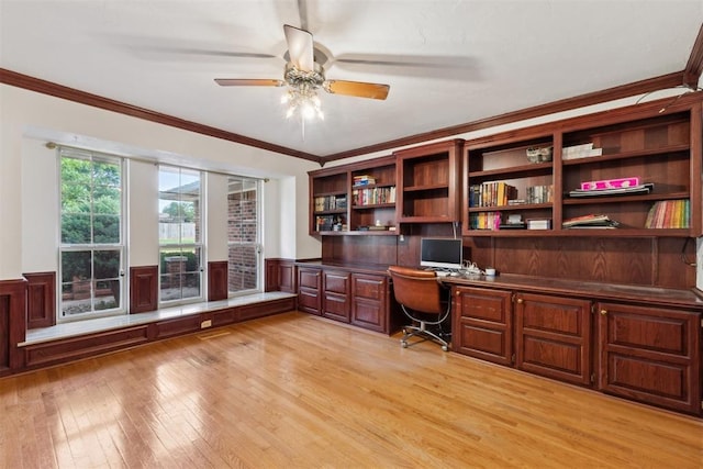 805 John F Kroutil Dr, Yukon, OK 73099 - office featuring built in study area, light wood-style flooring, a ceiling fan, crown molding, and a wainscoted wall