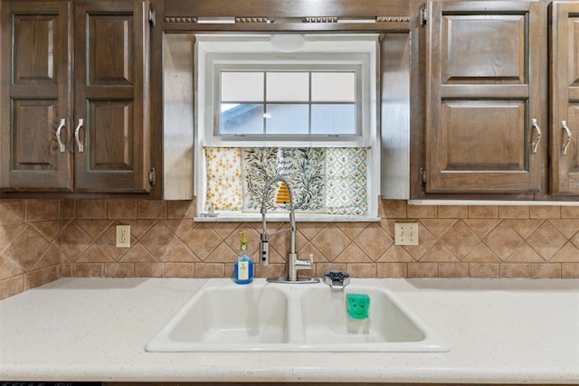 805 John F Kroutil Dr, Yukon, OK 73099 - kitchen with a sink, light countertops, and tasteful backsplash