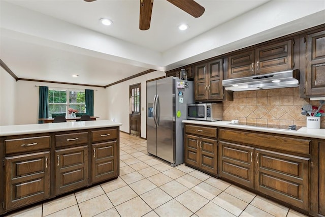 805 John F Kroutil Dr, Yukon, OK 73099 - kitchen with stainless steel appliances, ceiling fan, under cabinet range hood, light countertops, and crown molding
