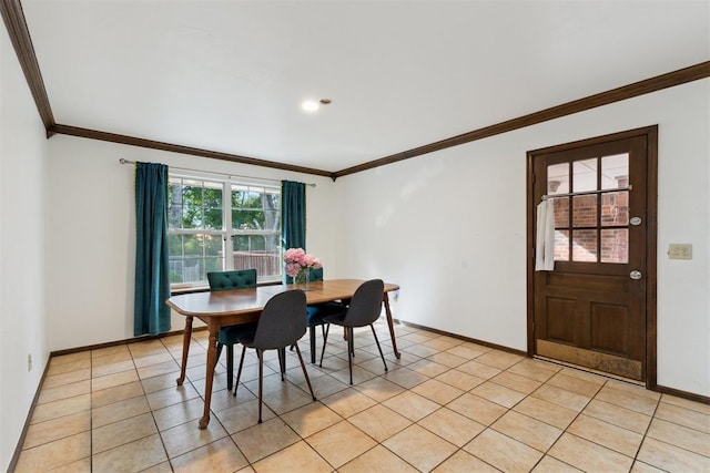 805 John F Kroutil Dr, Yukon, OK 73099 - dining room with ornamental molding, baseboards, and light tile patterned floors