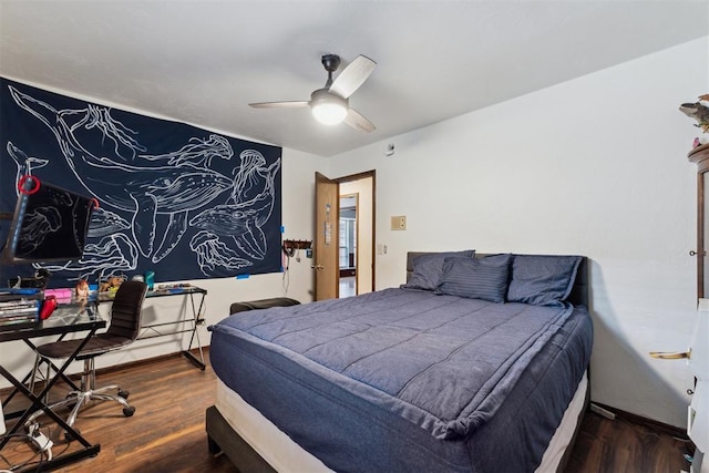 805 John F Kroutil Dr, Yukon, OK 73099 - bedroom with wood finished floors, a desk, a ceiling fan, and baseboards