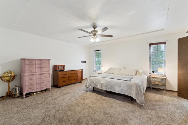 805 John F Kroutil Dr, Yukon, OK 73099 - carpeted bedroom with multiple windows and ceiling fan