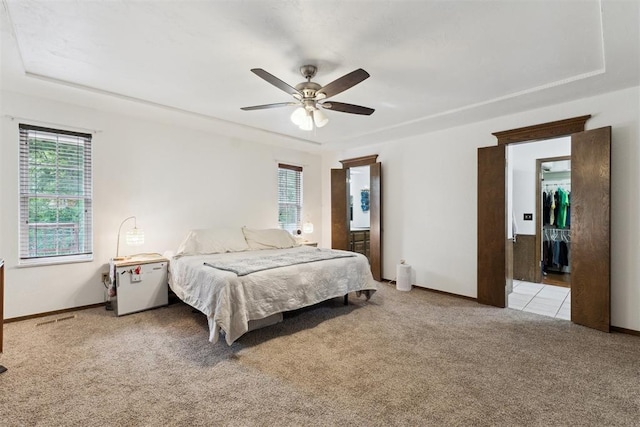 805 John F Kroutil Dr, Yukon, OK 73099 - bedroom featuring light carpet, multiple windows, and baseboards