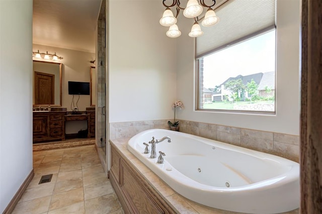 4408 The Ranch Rd, Edmond, OK 73034 - full bath with a jetted tub, a stall shower, a chandelier, and vanity