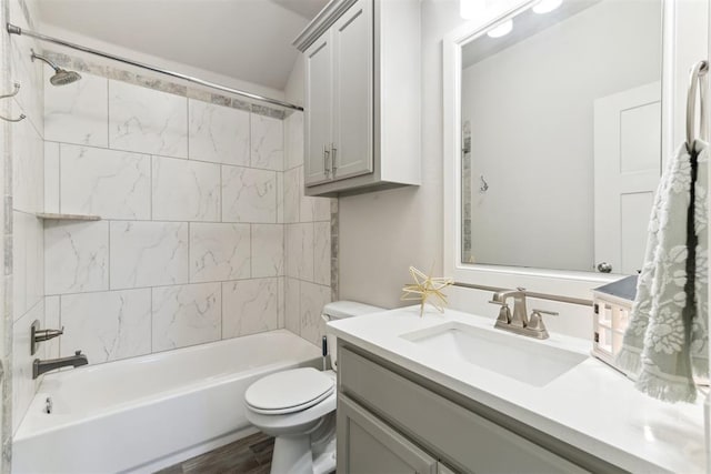 full bath featuring vanity, toilet, shower / tub combination, and wood finished floors