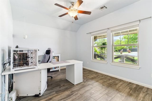 office space featuring lofted ceiling, a ceiling fan, wood finished floors, and baseboards