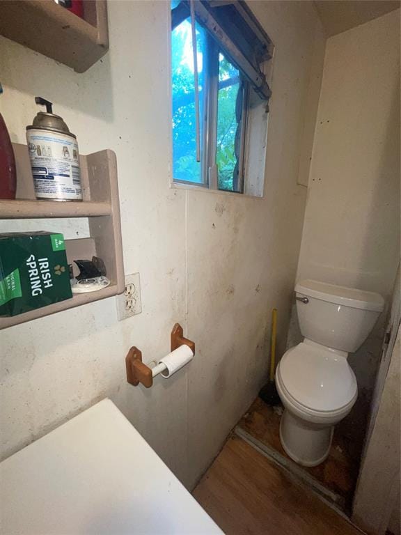 422 E Ash St, Lexington, OK 73051 - bathroom with toilet and wood finished floors