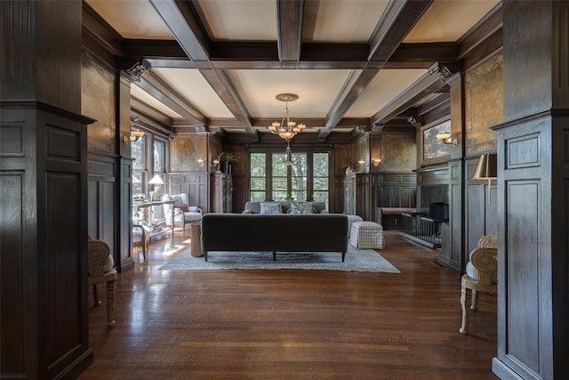 1415 N Hudson Ave, Oklahoma City, OK 73103 - living room with a decorative wall, a premium fireplace, a chandelier, beam ceiling, and coffered ceiling