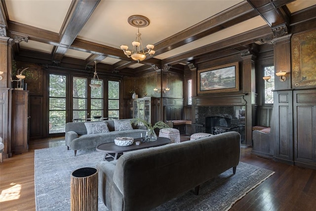 1415 N Hudson Ave, Oklahoma City, OK 73103 - living room featuring coffered ceiling, a decorative wall, a chandelier, beamed ceiling, and a premium fireplace
