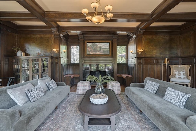 1415 N Hudson Ave, Oklahoma City, OK 73103 - living area featuring a premium fireplace, healthy amount of natural light, coffered ceiling, wood finished floors, and beamed ceiling
