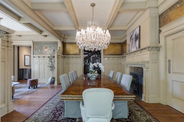1415 N Hudson Ave, Oklahoma City, OK 73103 - dining space with a chandelier, wood finished floors, a decorative wall, coffered ceiling, and a fireplace