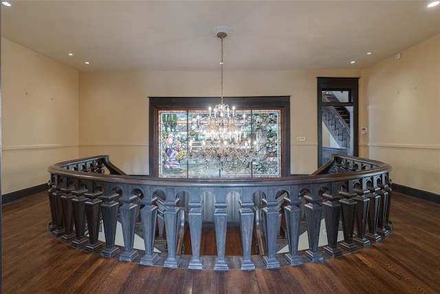 1415 N Hudson Ave, Oklahoma City, OK 73103 - stairway featuring wood finished floors, baseboards, recessed lighting, a chandelier, and a bar