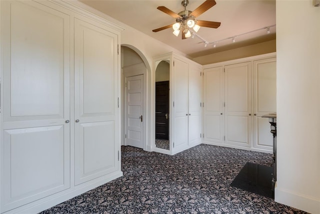 1415 N Hudson Ave, Oklahoma City, OK 73103 - hall with track lighting, arched walkways, and dark colored carpet