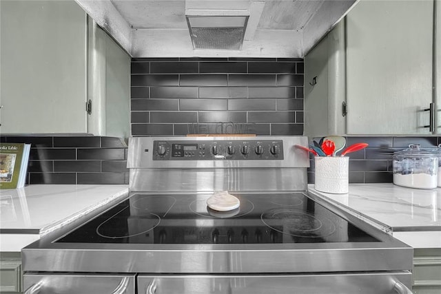 800 N Main St, Thomas, OK 73669 - kitchen with stainless steel range with electric stovetop, light countertops, and tasteful backsplash