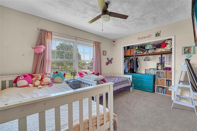 800 N Main St, Thomas, OK 73669 - bedroom with a textured ceiling, carpet, a closet, and a ceiling fan