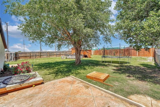 800 N Main St, Thomas, OK 73669 - view of yard with a trampoline and a patio