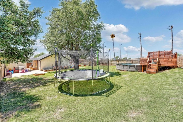 800 N Main St, Thomas, OK 73669 - view of yard featuring a trampoline