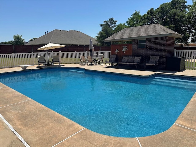 606 Cypress Ct, Blanchard, OK 73010 - view of pool featuring an outdoor structure, a patio area, outdoor lounge area, a diving board, and outdoor dining area