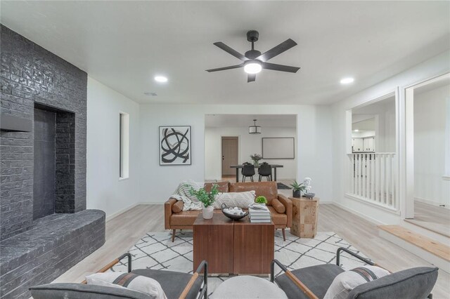 6212 N Utah Ave, Oklahoma City, OK 73112 - living area featuring a fireplace, light wood-type flooring, a ceiling fan, baseboards, and recessed lighting