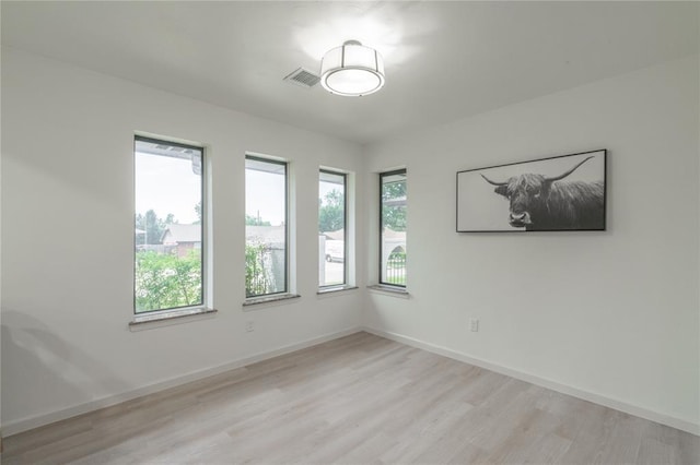 6212 N Utah Ave, Oklahoma City, OK 73112 - spare room with light wood-type flooring and baseboards