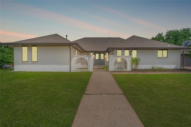 6212 N Utah Ave, Oklahoma City, OK 73112 - view of front of house featuring a lawn and a shingled roof