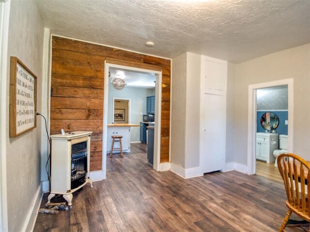 164 4th St, Faxon, OK 73540 - living room with dark wood finished floors, baseboards, and a textured ceiling