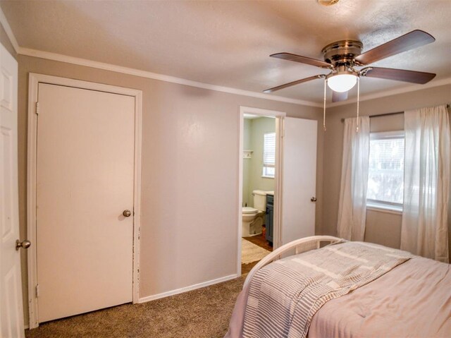 164 4th St, Faxon, OK 73540 - bedroom featuring carpet floors, baseboards, crown molding, connected bathroom, and ceiling fan
