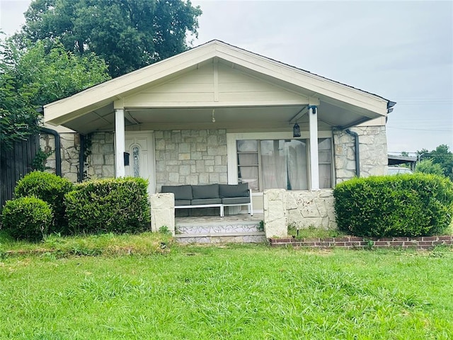 209 SW 40th St, Oklahoma City, OK 73109 - bungalow-style home with stone siding and a front yard