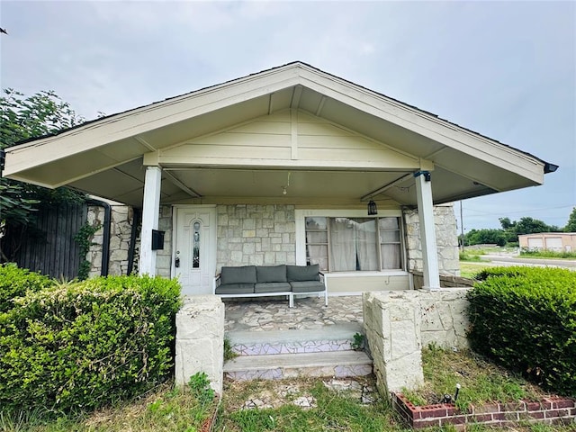 209 SW 40th St, Oklahoma City, OK 73109 - exterior space with a porch, stone siding, and outdoor lounge area