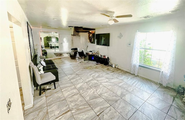 209 SW 40th St, Oklahoma City, OK 73109 - living area featuring a ceiling fan and light marble finish floors