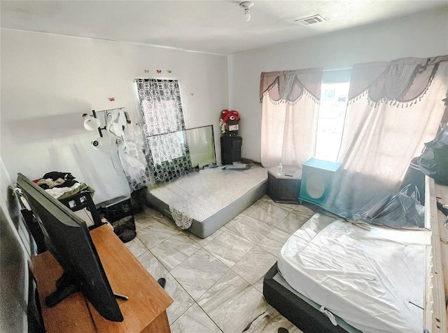 209 SW 40th St, Oklahoma City, OK 73109 - bedroom featuring light marble finish floors