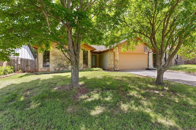 view of property hidden behind natural elements with stone siding, an attached garage, and concrete driveway