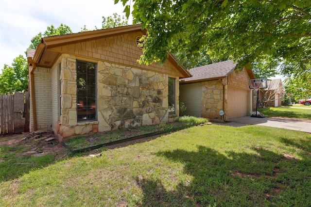 view of home's exterior with stone siding, a garage, an outdoor structure, and driveway