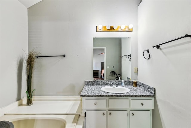 bathroom featuring vanity and connected bathroom