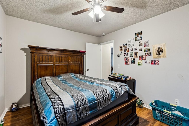 bedroom with baseboards, a textured ceiling, wood finished floors, and ceiling fan