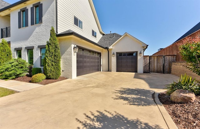 4209 Las Colinas Ln, Norman, OK 73072 - view of home's exterior featuring concrete driveway and brick siding