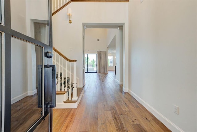 4209 Las Colinas Ln, Norman, OK 73072 - entryway with a towering ceiling, stairs, wood finished floors, and baseboards