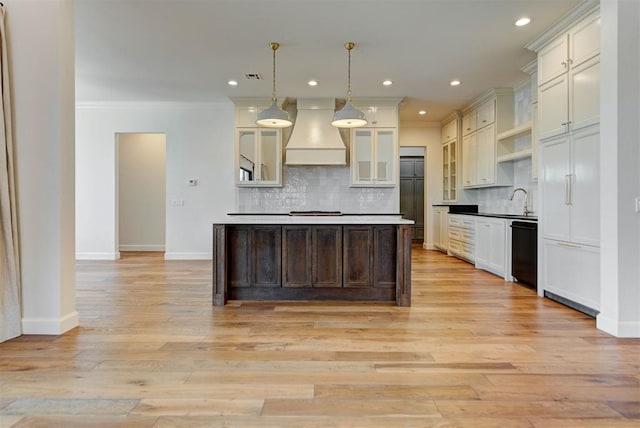 4209 Las Colinas Ln, Norman, OK 73072 - kitchen with premium range hood, black dishwasher, light wood-style floors, tasteful backsplash, and built in refrigerator