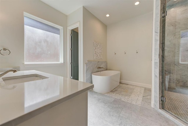 4209 Las Colinas Ln, Norman, OK 73072 - bathroom with a stall shower, a soaking tub, marble finish floors, recessed lighting, and vanity