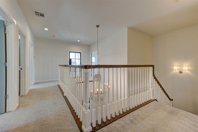 4209 Las Colinas Ln, Norman, OK 73072 - corridor with an upstairs landing, carpet floors, recessed lighting, baseboards, and a chandelier