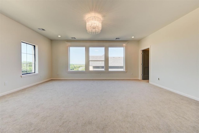 4209 Las Colinas Ln, Norman, OK 73072 - empty room featuring a chandelier, light colored carpet, baseboards, and recessed lighting