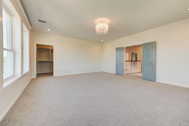 4209 Las Colinas Ln, Norman, OK 73072 - empty room with light colored carpet, baseboards, a chandelier, and recessed lighting