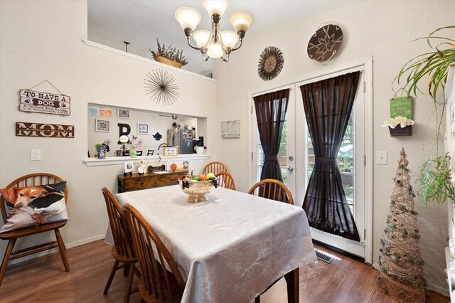 6104 Westlane, Oklahoma City, OK 73142 - dining space with a chandelier, wood finished floors, and baseboards