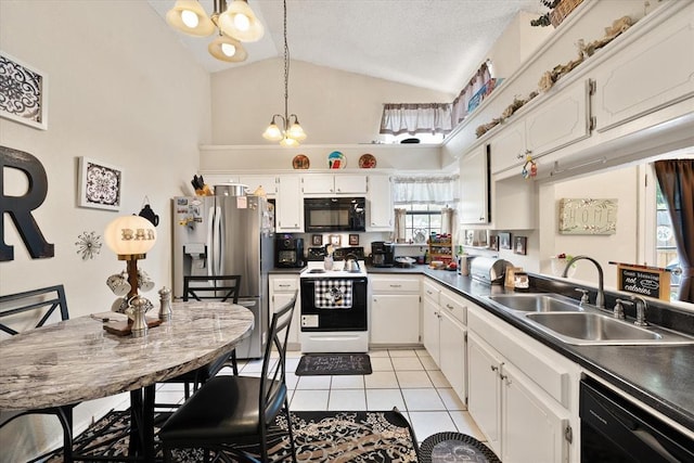 6104 Westlane, Oklahoma City, OK 73142 - kitchen featuring black appliances, a chandelier, a sink, light tile patterned floors, and high vaulted ceiling