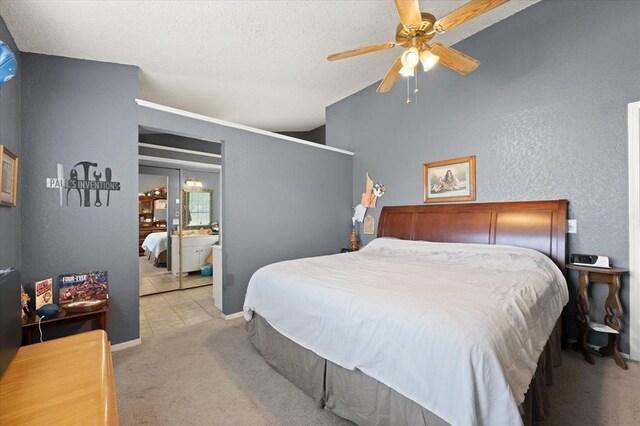 6104 Westlane, Oklahoma City, OK 73142 - carpeted bedroom with baseboards, a textured ceiling, ceiling fan, and ensuite bath