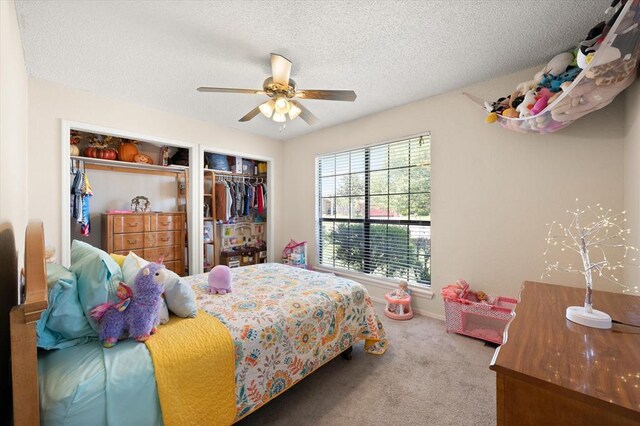 6104 Westlane, Oklahoma City, OK 73142 - carpeted bedroom featuring a textured ceiling and ceiling fan