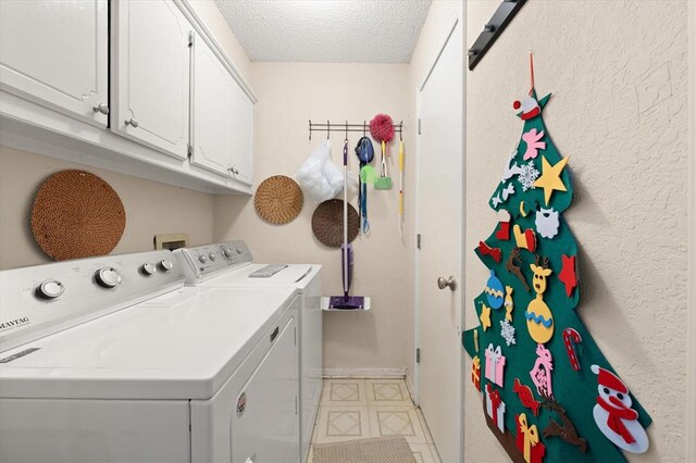 6104 Westlane, Oklahoma City, OK 73142 - laundry room featuring washing machine and dryer, a textured ceiling, baseboards, cabinet space, and light flooring