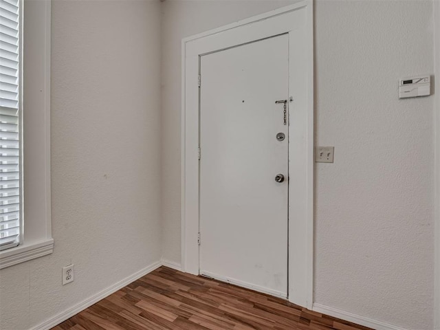 doorway to outside featuring wood finished floors