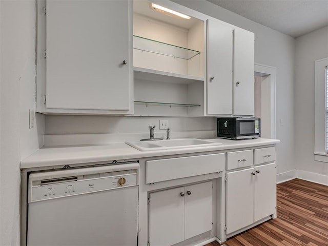 kitchen featuring dishwasher, white cabinets, and light countertops