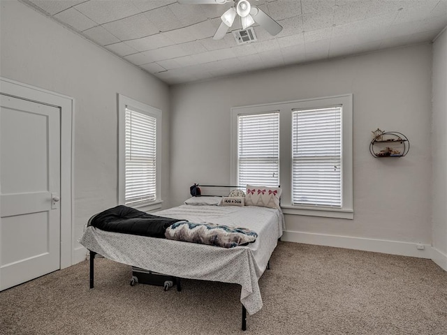 bedroom with carpet flooring, ceiling fan, and baseboards